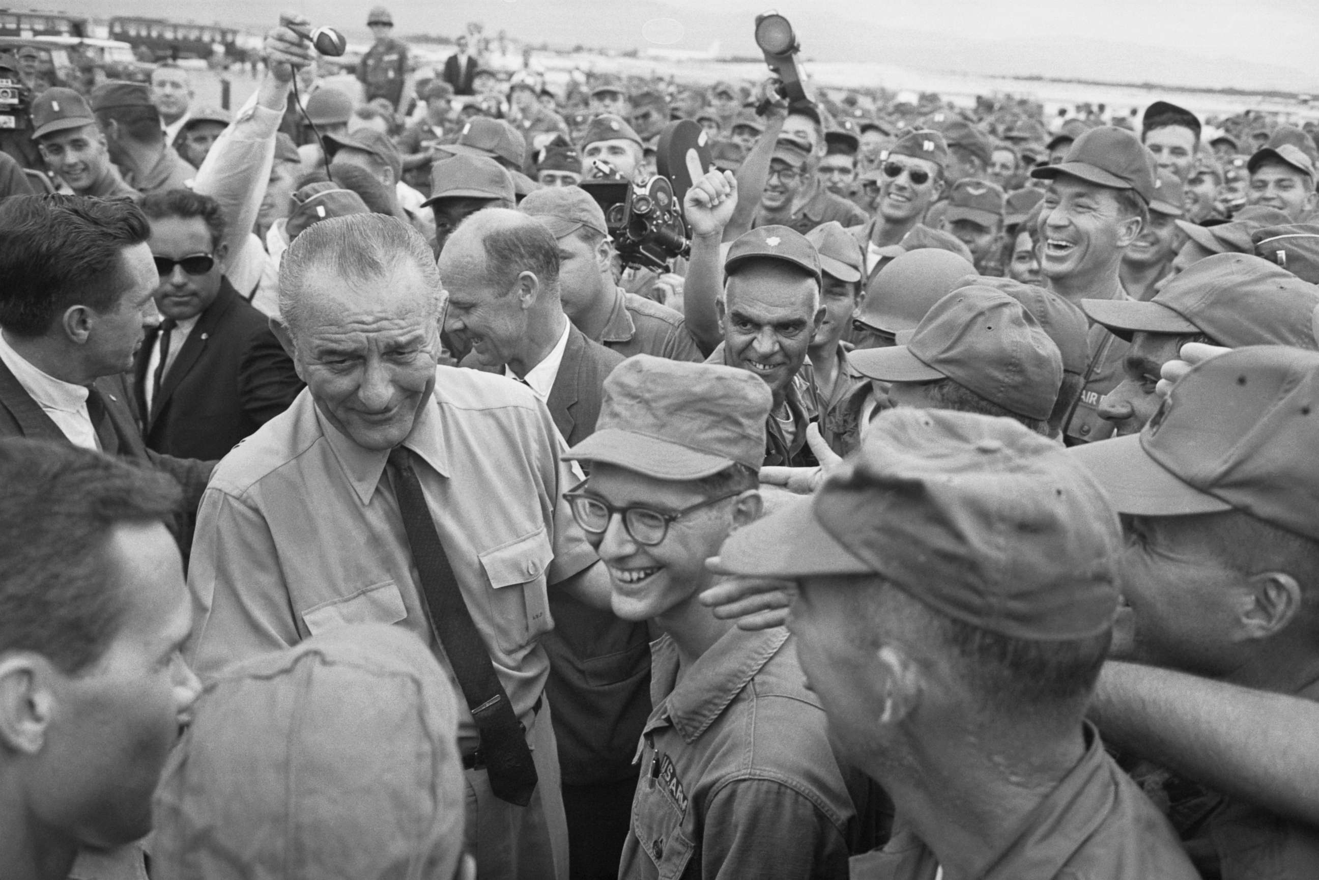 PHOTO: Cheering U.S. soldiers surround President Johnson as he arrives on an un-announced visit, Oct. 26, 1966, in Cam Ranh, Vietnam.