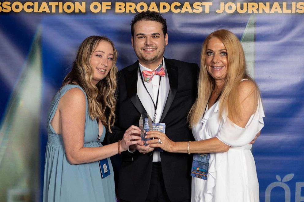 PHOTO: TV journalist Dylan Lyons, 24, poses for a photo with his girlfriend, left, and mom at the Florida Association of Broadcast Journalists awards ceremony on May 7, 2022 in Orlando, Fla.