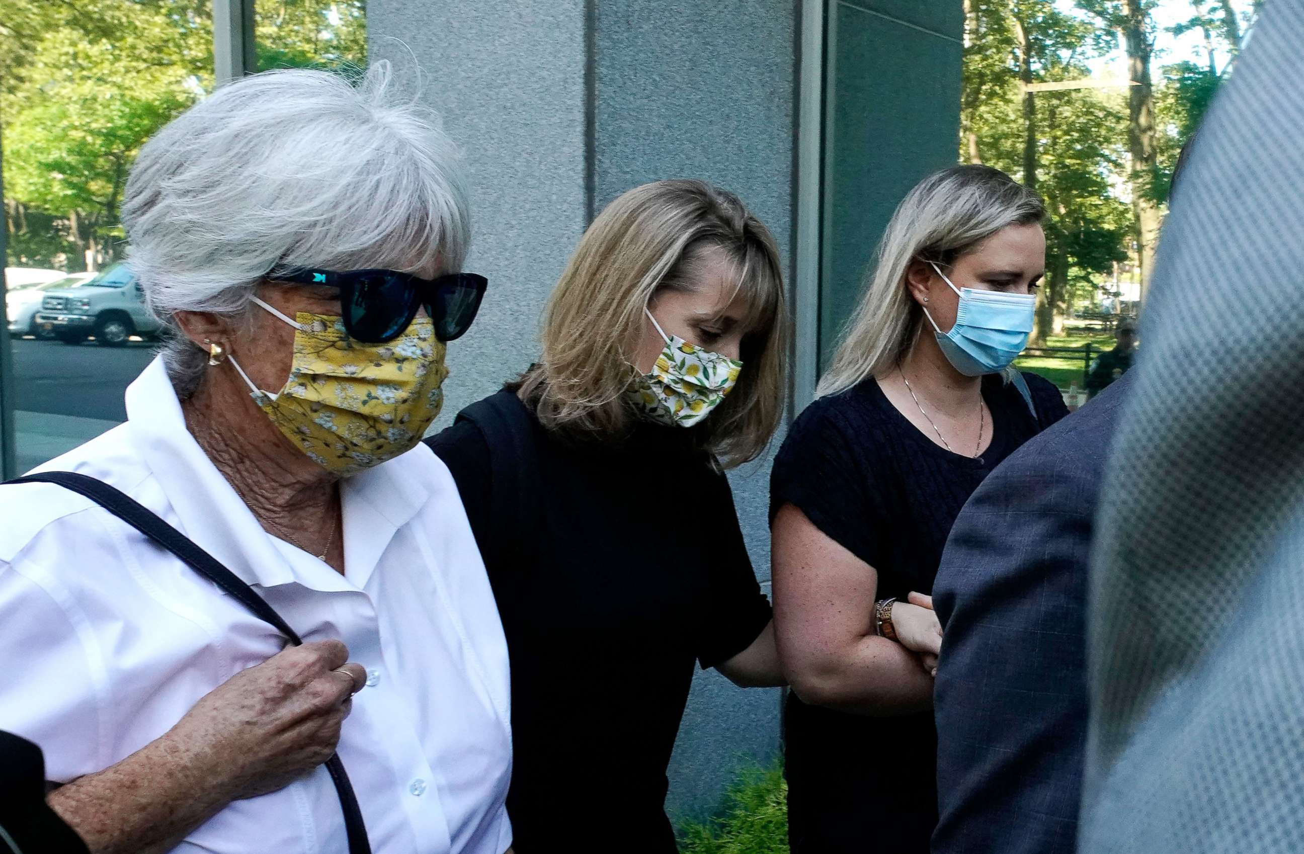 PHOTO: Allison Mack, center, arrives at Brooklyn Federal Court on June 30, 2021 in New York, to be sentenced for her role in the alleged sex cult NXIVM.