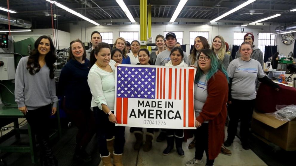 PHOTO: Workers in Minneapolis hold up a "Made in America" sign.