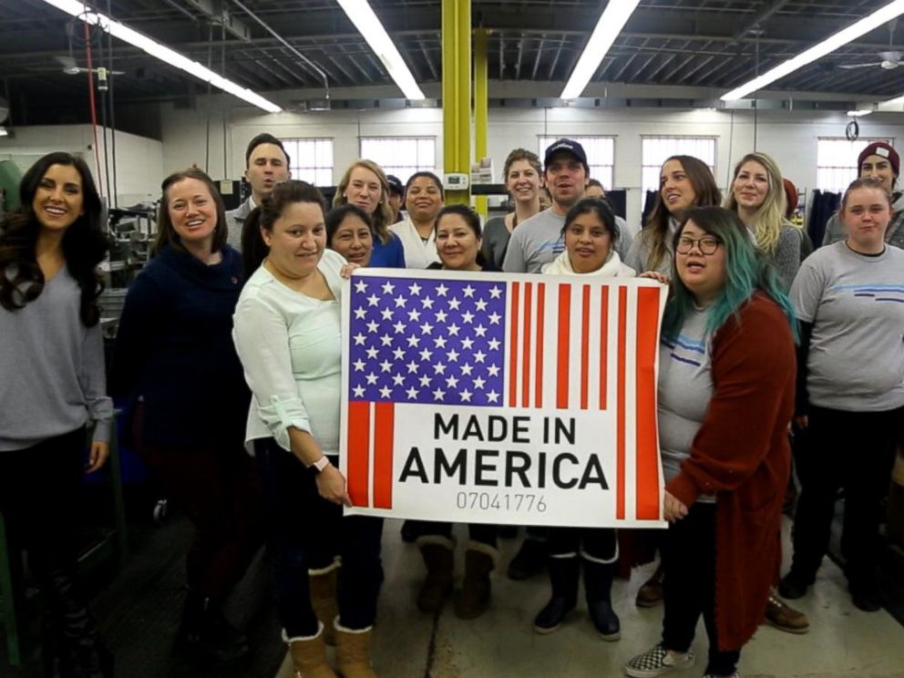 PHOTO: Workers in Minneapolis hold up a Made in America sign.