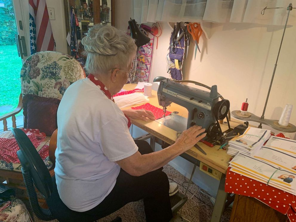 PHOTO: Krier works on masks made of the iconic red polka dot fabric "Rosies" were famous for.