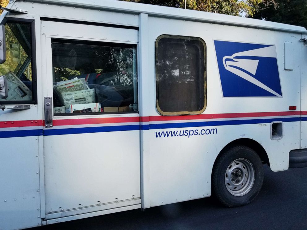 PHOTO: In this Oct. 18, 2017, file photo, a United States Postal Service (USPS) delivery truck delivers mail and packages in San Ramon, Calif.
