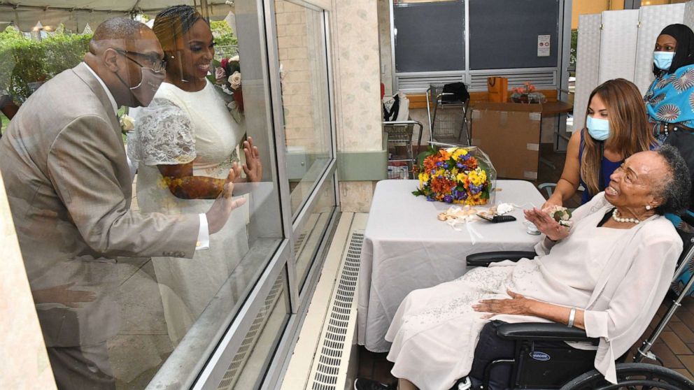 VIDEO: Nursing home resident watches daughter’s wedding from window