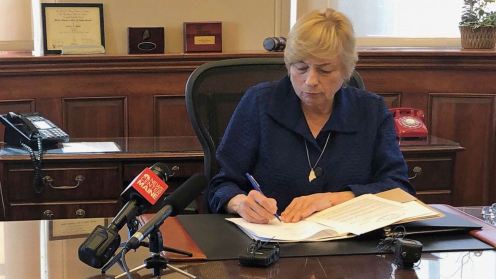 PHOTO: Maine Democratic Gov. Janet Mills signs a bill Wednesday, June 12, 2019, in her office in Augusta, Maine, becoming the eighth state to allow terminally ill people to end their lives with prescribed medication.