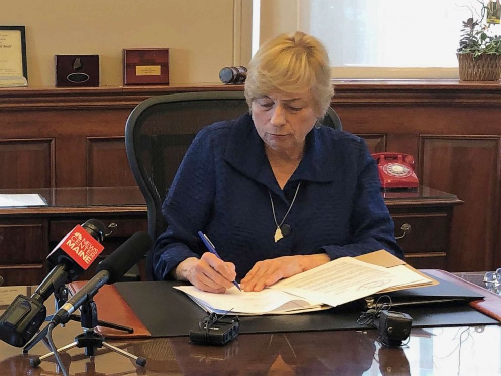 PHOTO: Maine Democratic Gov. Janet Mills signs a bill Wednesday, June 12, 2019, in her office in Augusta, Maine, becoming the eighth state to allow terminally ill people to end their lives with prescribed medication.
