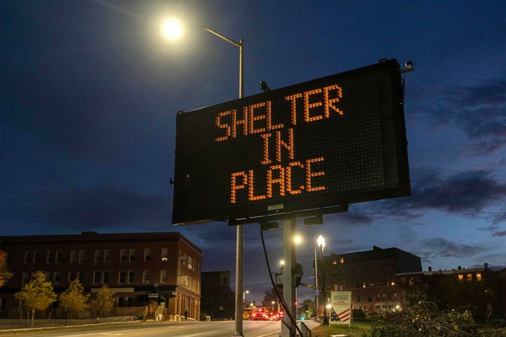 PHOTO: A sign advises residents to stay home, Oct. 26, 2023, following a mass shooting at a restaurant and a bowling alley in Lewiston, Maine. Police continue to search for the suspect.