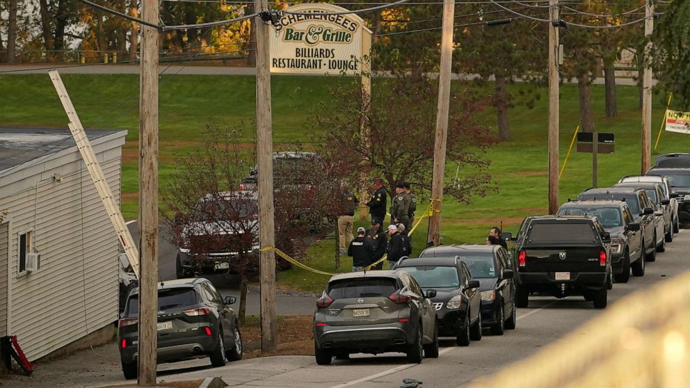 PHOTO: Law enforcement gather outside Schemengee's Bar and Grille, Oct. 26, 2023, in Lewiston, Maine.