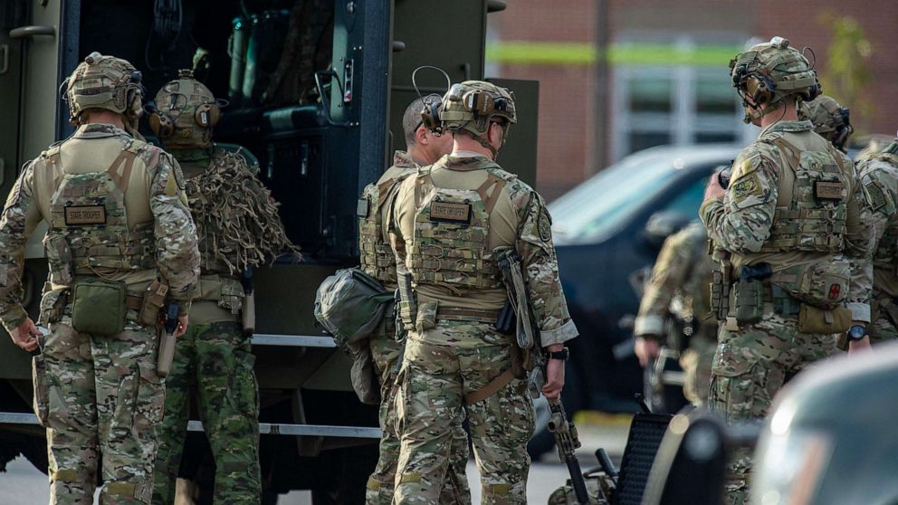 PHOTO: Law enforcement officers gather outside Lewiston High School, Maine on Oct. 26, 2023.