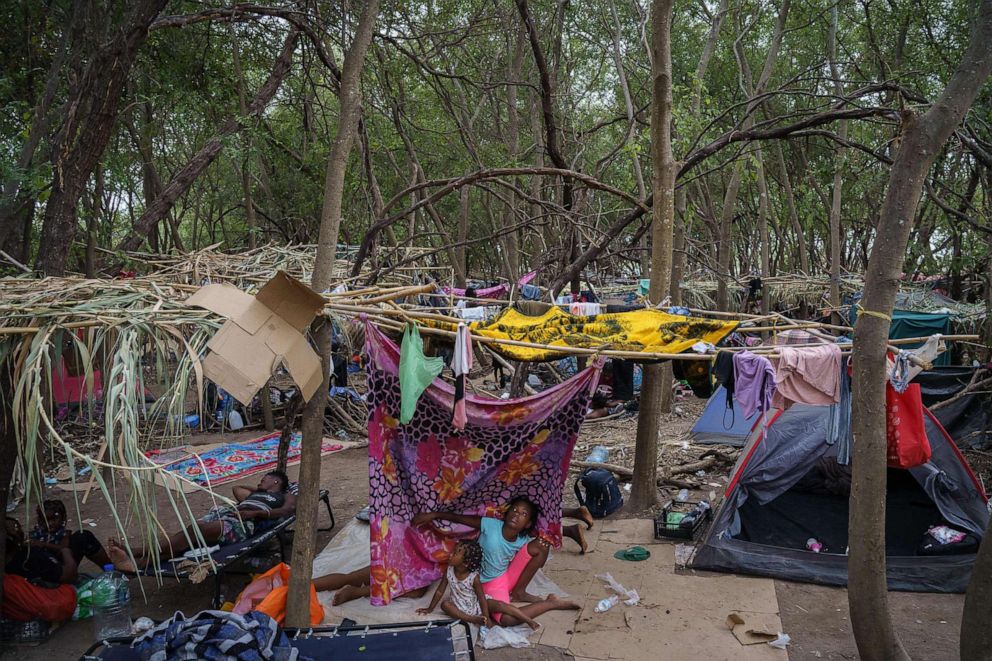 PHOTO: Haitians wait in a makeshift encampment thousands of people hoping to enter the United States, Sept. 21, 2021, in Del Rio, Texas.