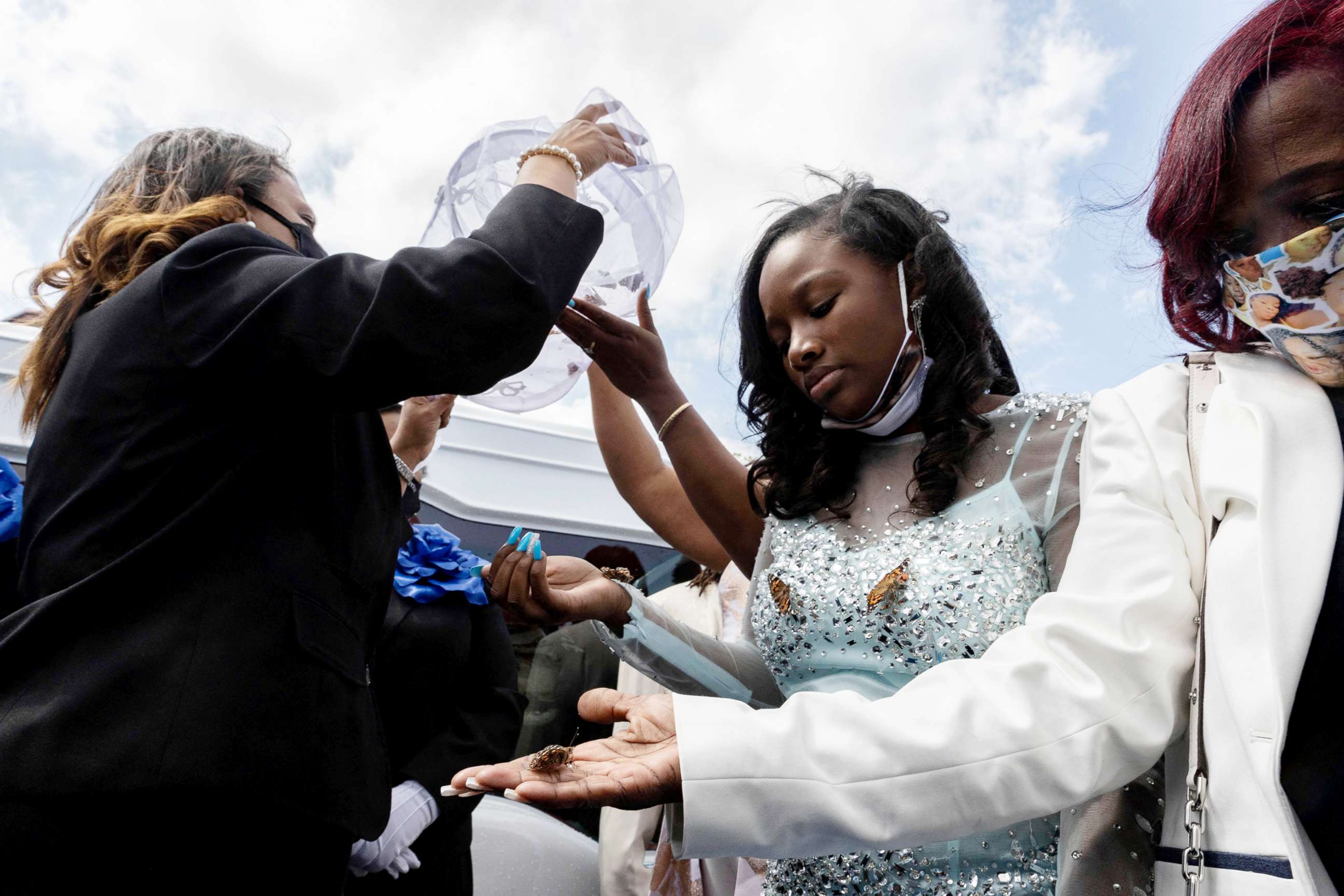 PHOTO: Ja'Niah Bryant releases butterflies into the air during funeral of her sister Ma'Khia Bryant in Columbus, Ohio, April 30, 2021.