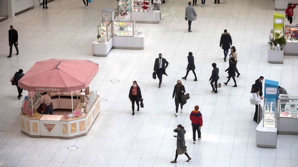 PHOTO: In this March 10, 2022, file photo, people walk in a shopping mall in New York.