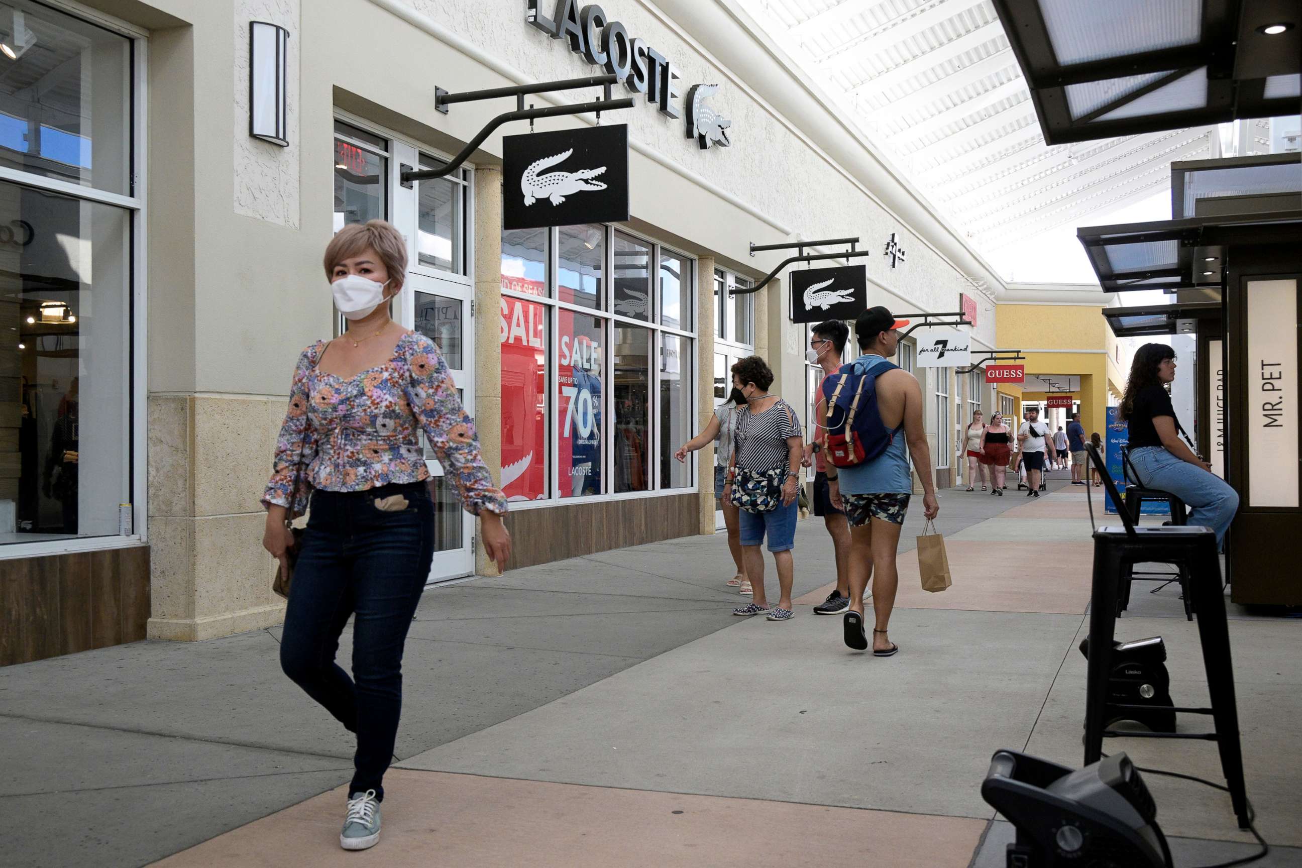 PHOTO: People walk through the Orlando Vineland Premium Outlets shopping mall on July 12, 2022, in Orlando, Fla.