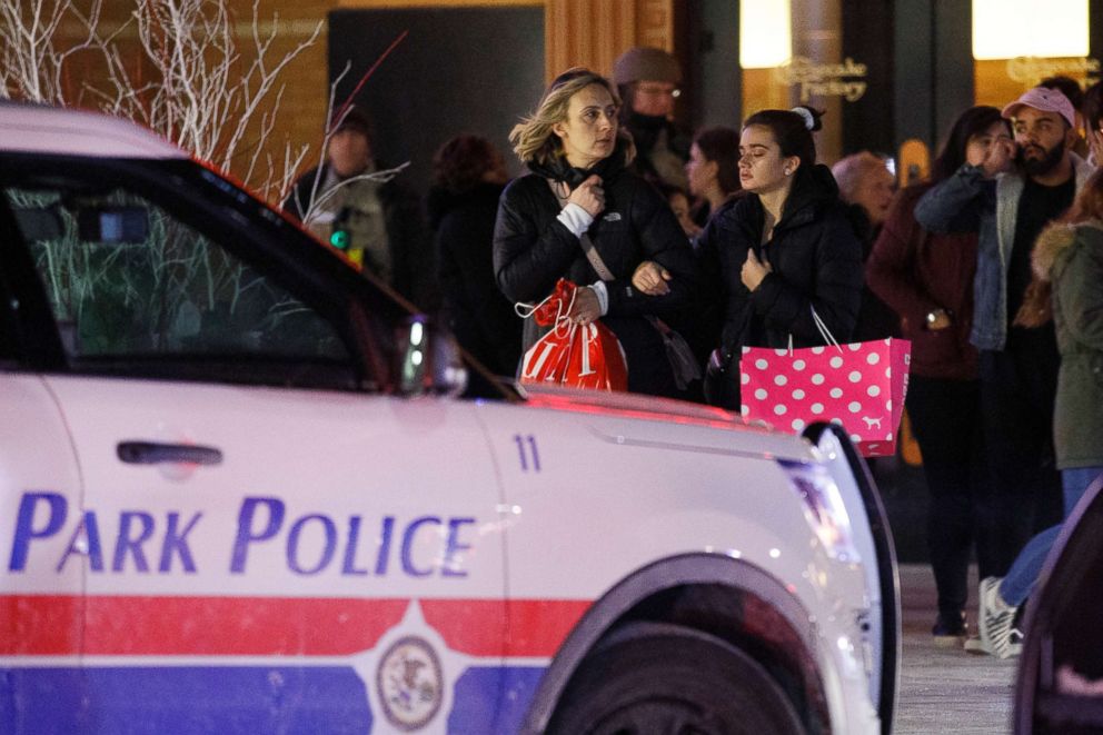 PHOTO: People leave the scene where a gunman shot and killed a man near the food court inside the Orland Square Mall, Jan. 21, 2019, in Orland Park, Ill. 