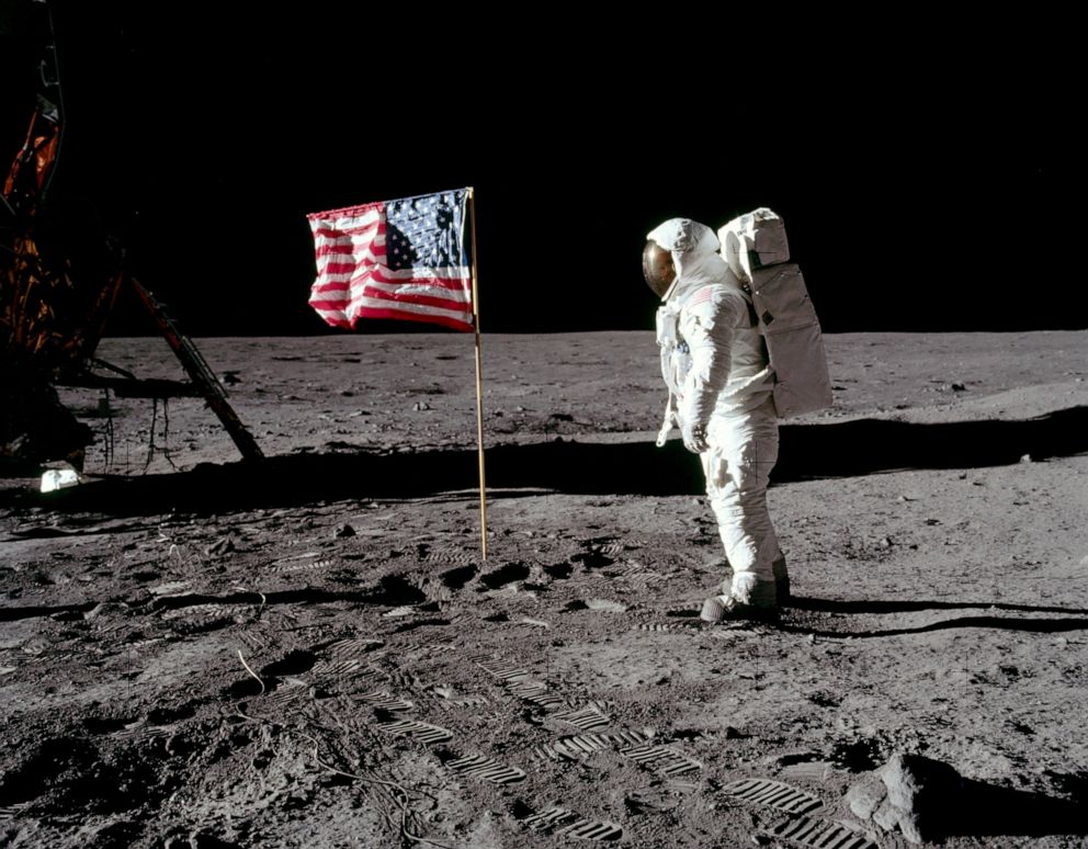 PHOTO: Astronaut Buzz Aldrin, lunar module pilot for Apollo 11, poses for a photograph besides the United States flag during an extravehicular activity on the moon, July 20, 1969. 