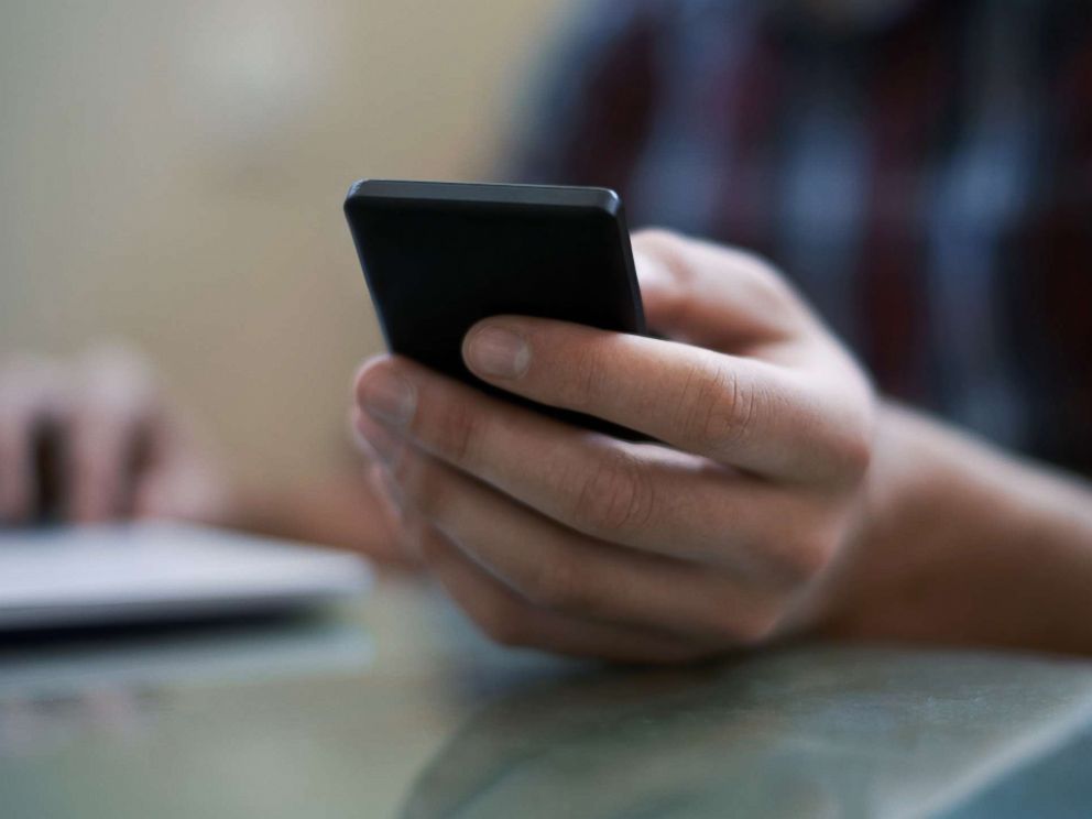 PHOTO: A man uses a cell phone in an undated stock photo.