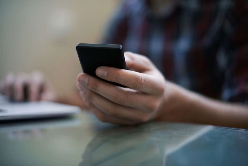 PHOTO: A man uses a cell phone in an undated stock photo.