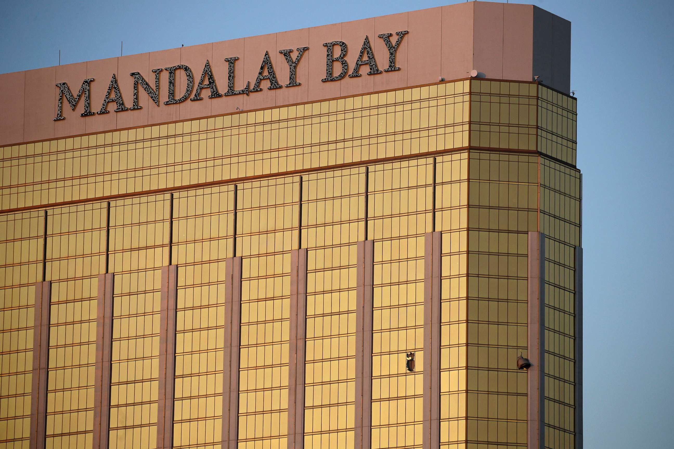 PHOTO: Drapes billow out of broken windows at the Mandalay Bay resort and casino on the Las Vegas Strip, Oct. 2, 2017, following a deadly shooting at a music festival.