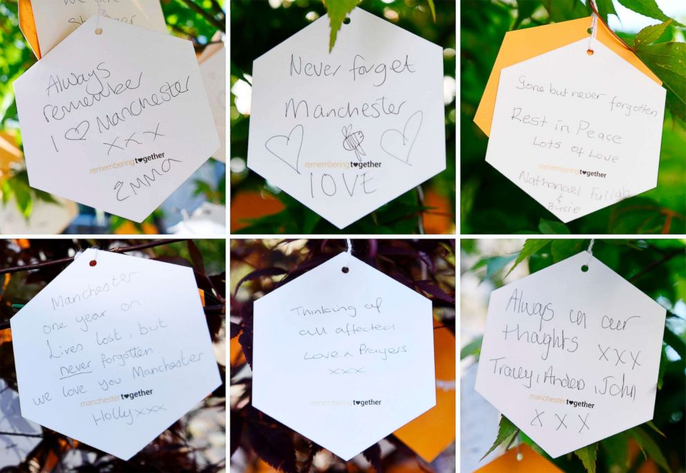PHOTO: A combination of pictures shows messages of support  hung from a 'tree of hope' planted as a memorial following the Manchester Arena bombing in central Manchester on May 22, 2018, the one year anniversary of the deadly attack.