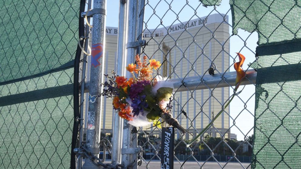 PHOTO: Flowers and a sign reading "HONOR 58" hang on a fence outside the Las Vegas Village across from Mandalay Bay Resort and Casino as a tribute to those killed almost two years ago in a massacre at the site on Sept. 30, 2019, in Las Vegas.