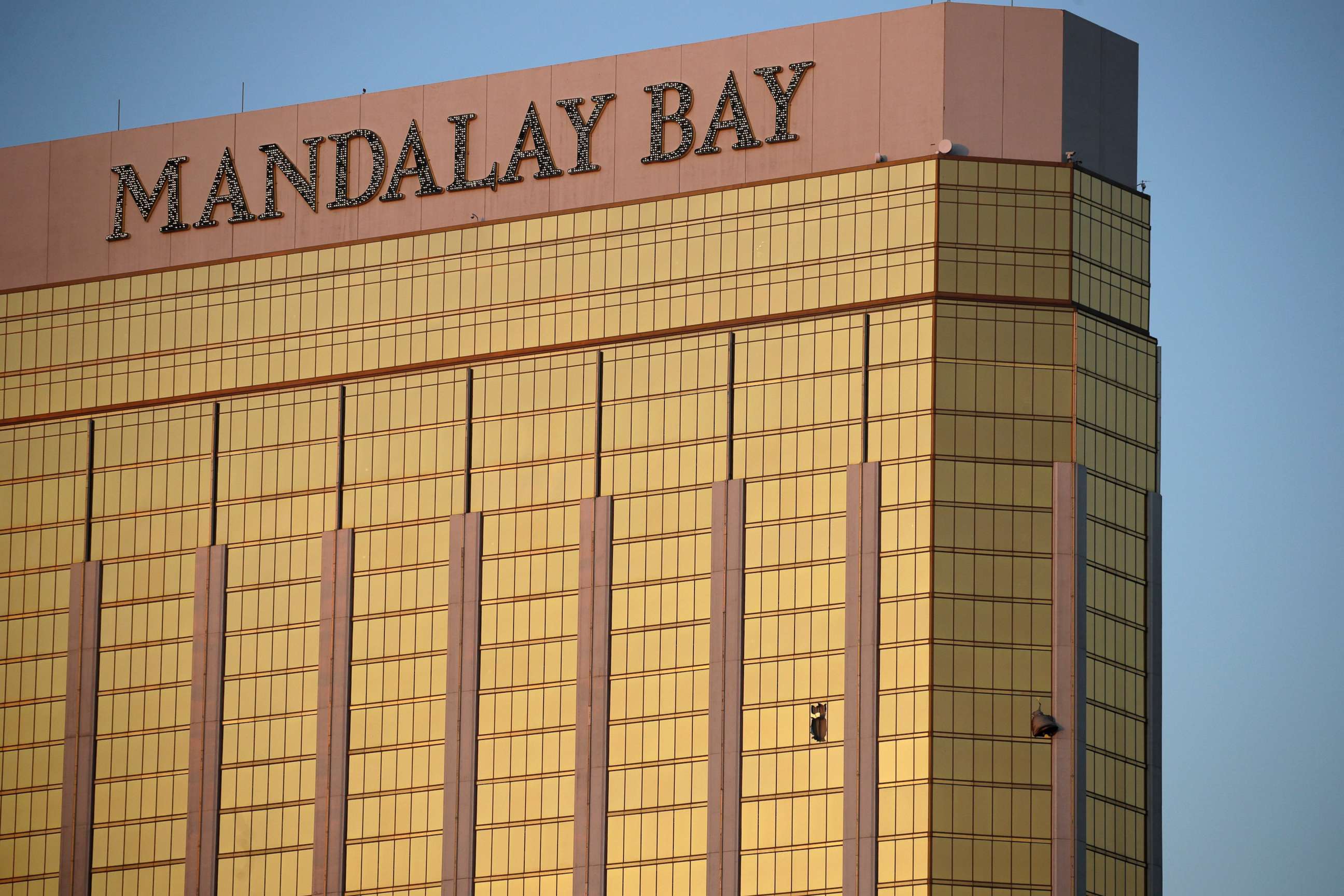 PHOTO: Drapes billow out of broken windows at the Mandalay Bay resort and casino, Oct. 2, 2017, on the Las Vegas Strip following a deadly shooting at a music festival in Las Vegas.