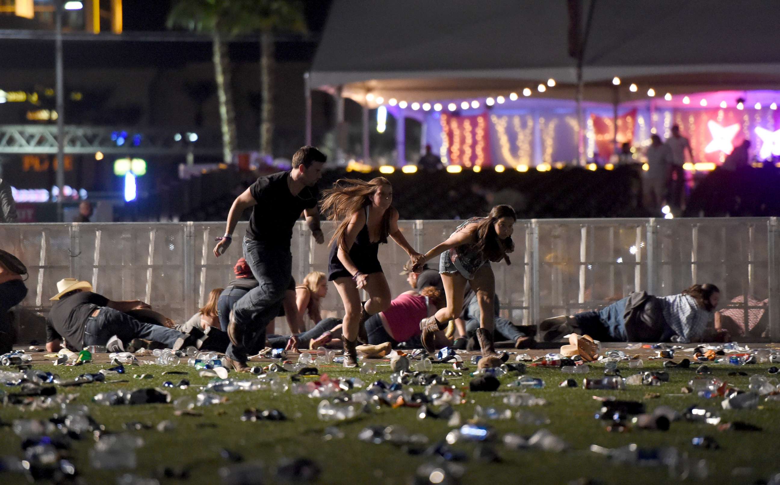 PHOTO: People run from the Route 91 Harvest country music festival after apparent gun fire was heard, Oct. 1, 2017, in Las Vegas.