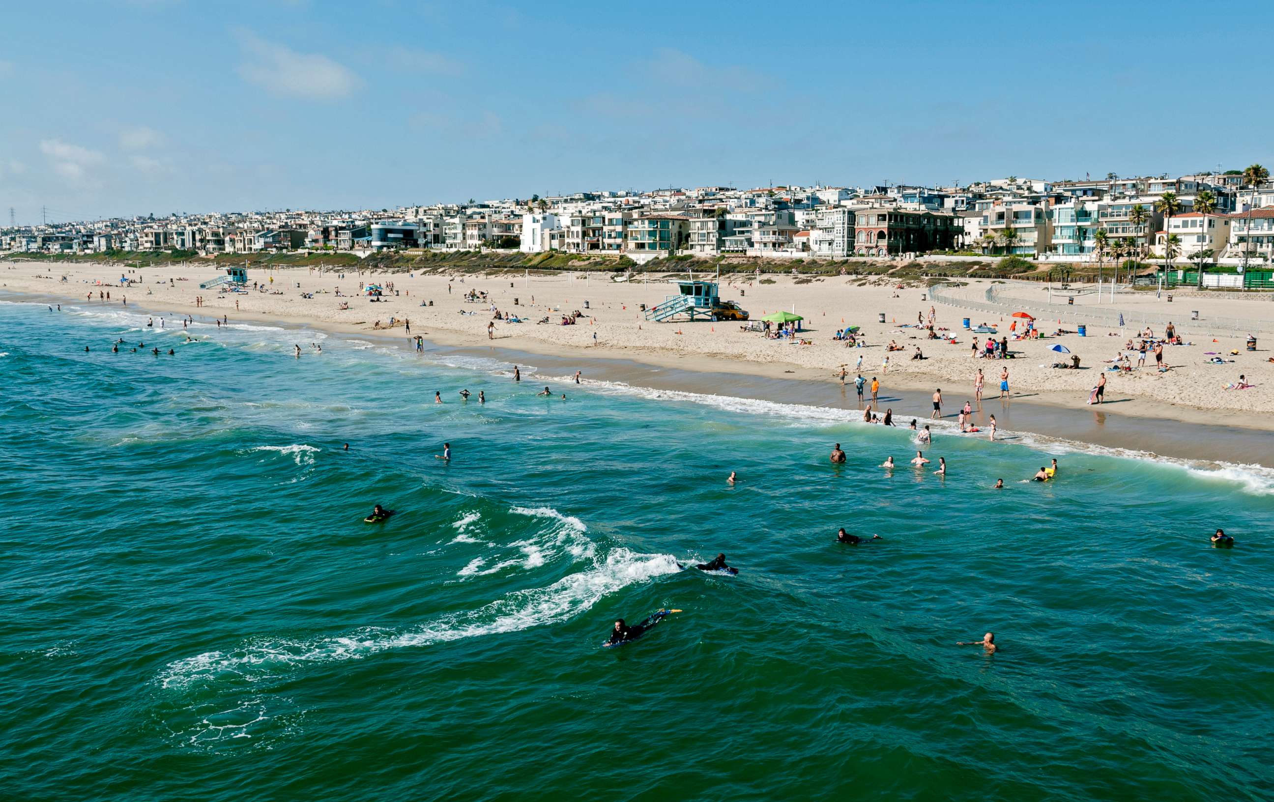 PHOTO: This stock photo depicts swimmers and surfers enjoying the water in Manhattan Beach, California.