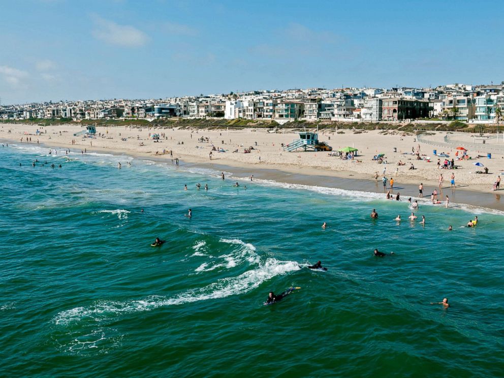 PHOTO: This stock photo depicts swimmers and surfers enjoying the water in Manhattan Beach, California.