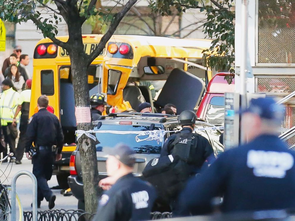 PHOTO: Authorities respond near a damaged school bus, Oct. 31, 2017, in New York.