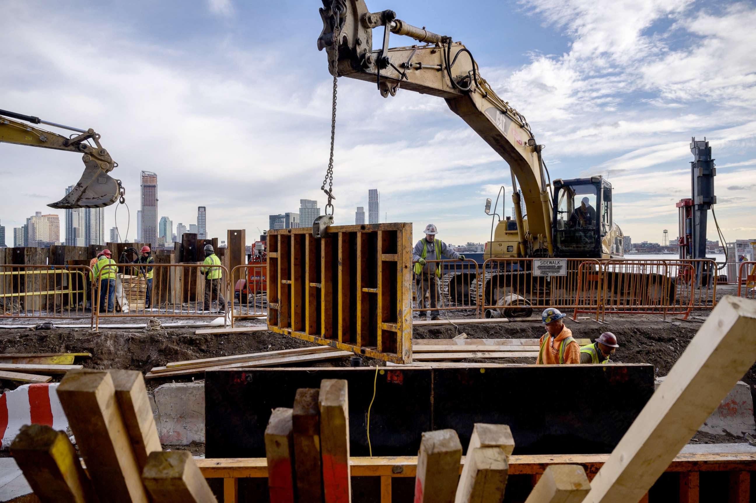 PHOTO: A general view shows contruction workers at the site of a flood defense project on the east side of Manhattan, New York city, Dec. 11, 2021.