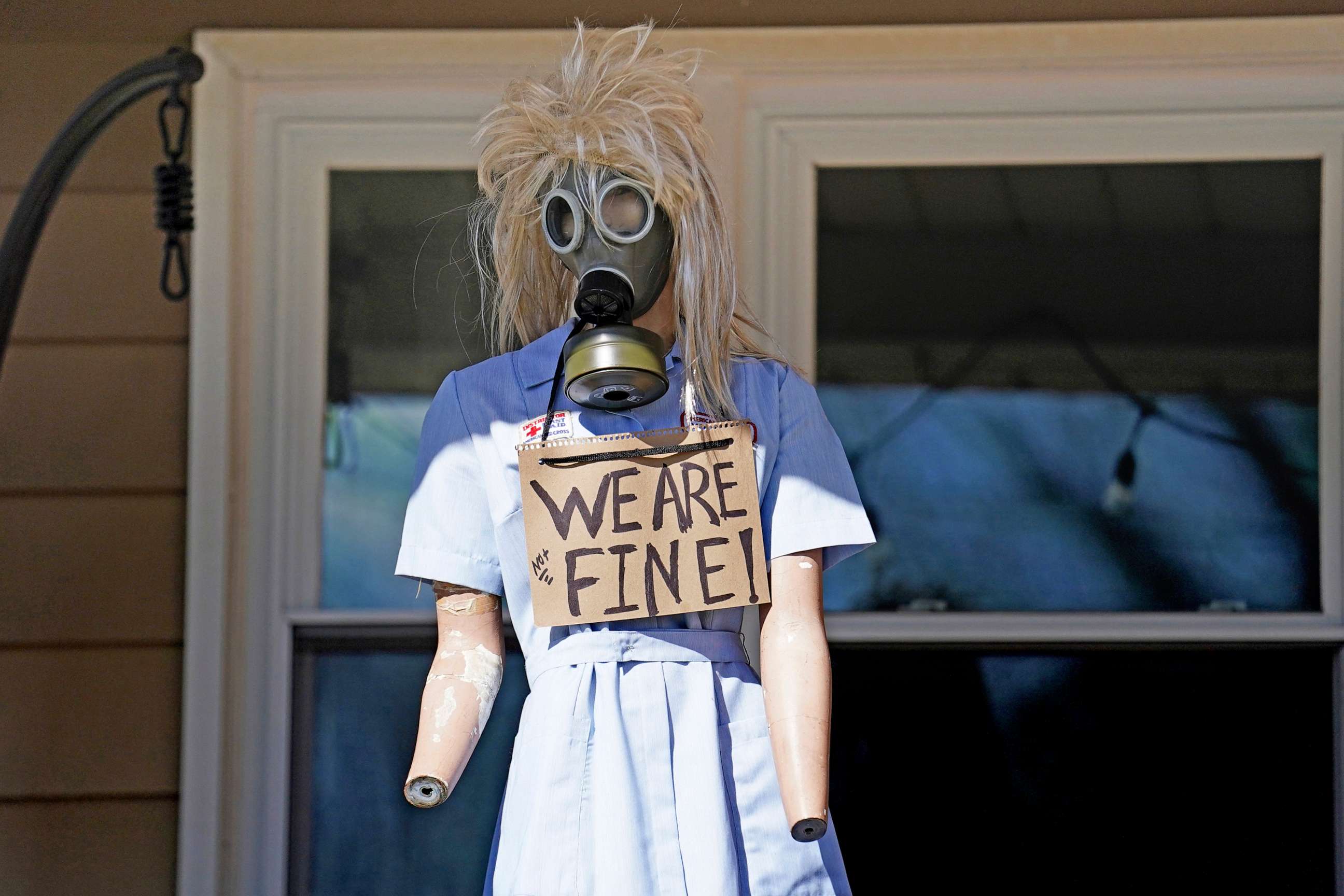PHOTO: A resident displays a mannequin on their porch in East Palestine, Ohio, on Feb. 24, 2023, as cleanup from a hazardous train derailment continues.