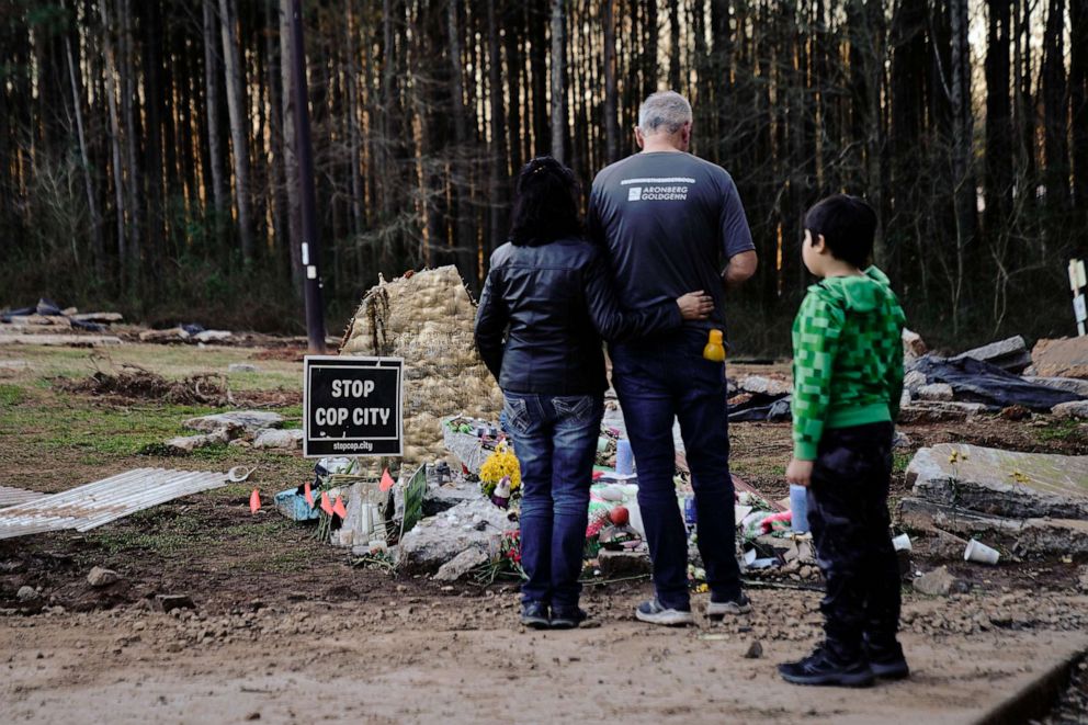 PHOTO: Family members of environmental activist Manuel Teran visit a makeshift memorial for Teran, who was allegedly shot by police during a raid to clear the construction site of a police training facility near Atlanta, on Feb. 6, 2023.