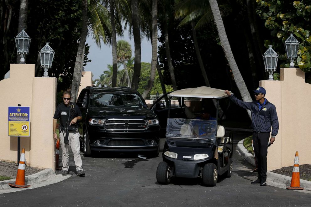 PHOTO: US Secret Service and Mar-A-Lago security members stand at the entrance of former President Donald Trump's house at Mar-A-Lago in Palm Beach, Florida, Aug. 9, 2022.