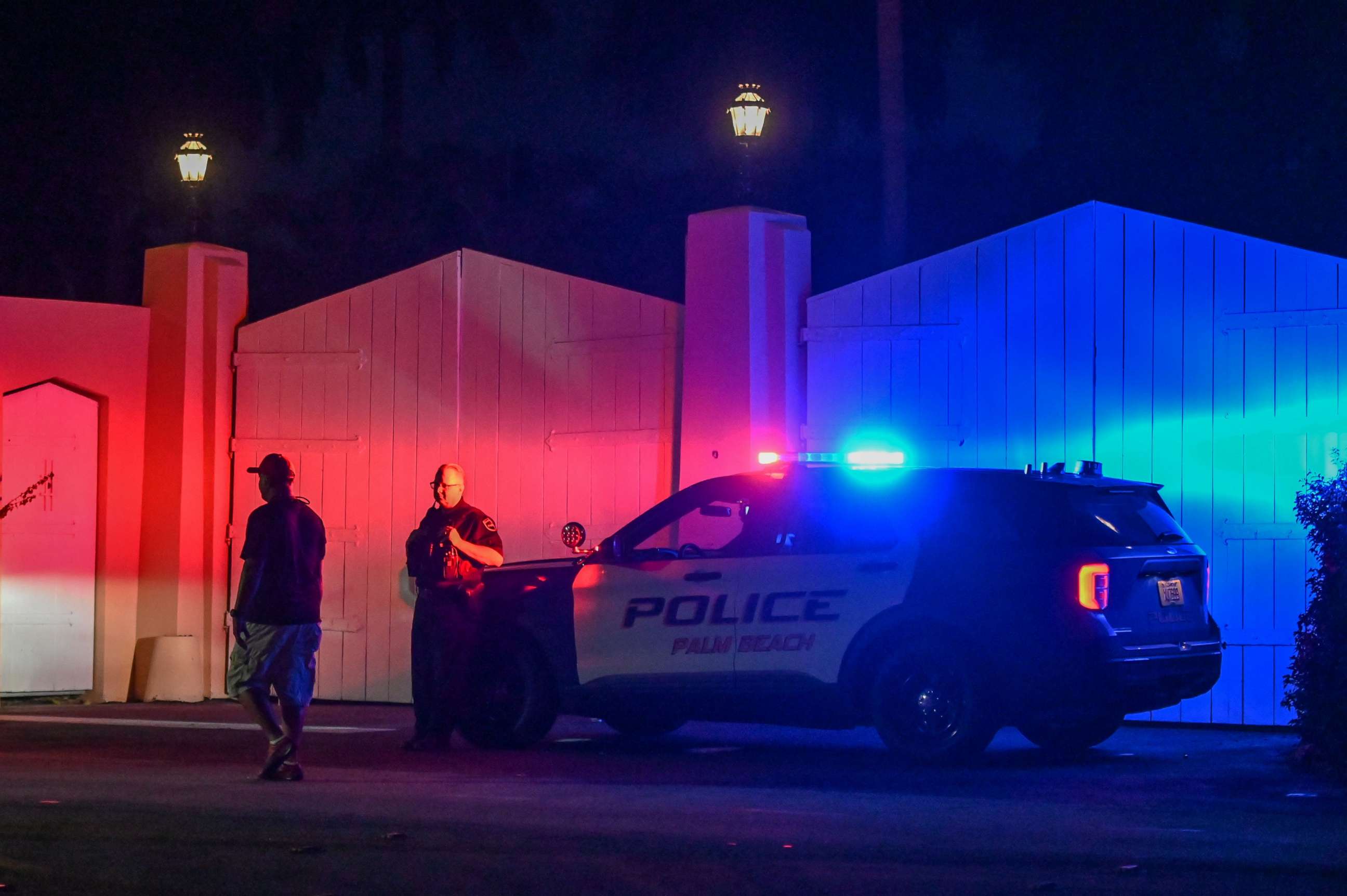 PHOTO: A police car is seen outside former U.S. President Donald Trump's Mar-a-Lago estate in Palm Beach, Florida, Aug. 8, 2022. Trump said the residence was being "raided" by FBI agents in what he called an act of "prosecutorial misconduct."