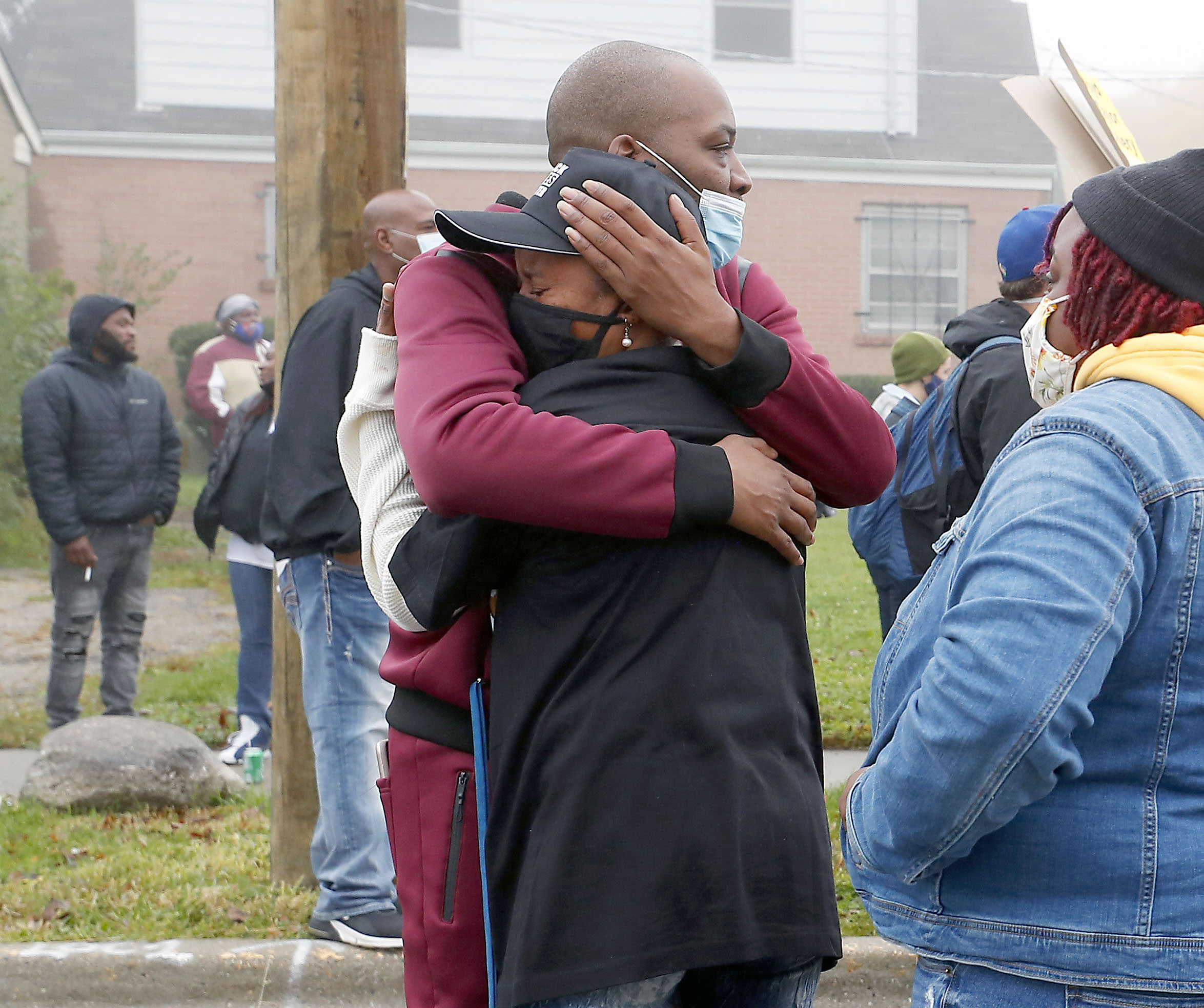 PHOTO: Sherrellis Sheria Stinnette, grandmother of Marcellis Stinnette, 19, is comforted by Rayon Edwards, of Waukegan, Ill., during a protest rally for Marcellis Stinnette who was killed by Waukegan Police in Waukegan, Ill., Oct. 22, 2020.