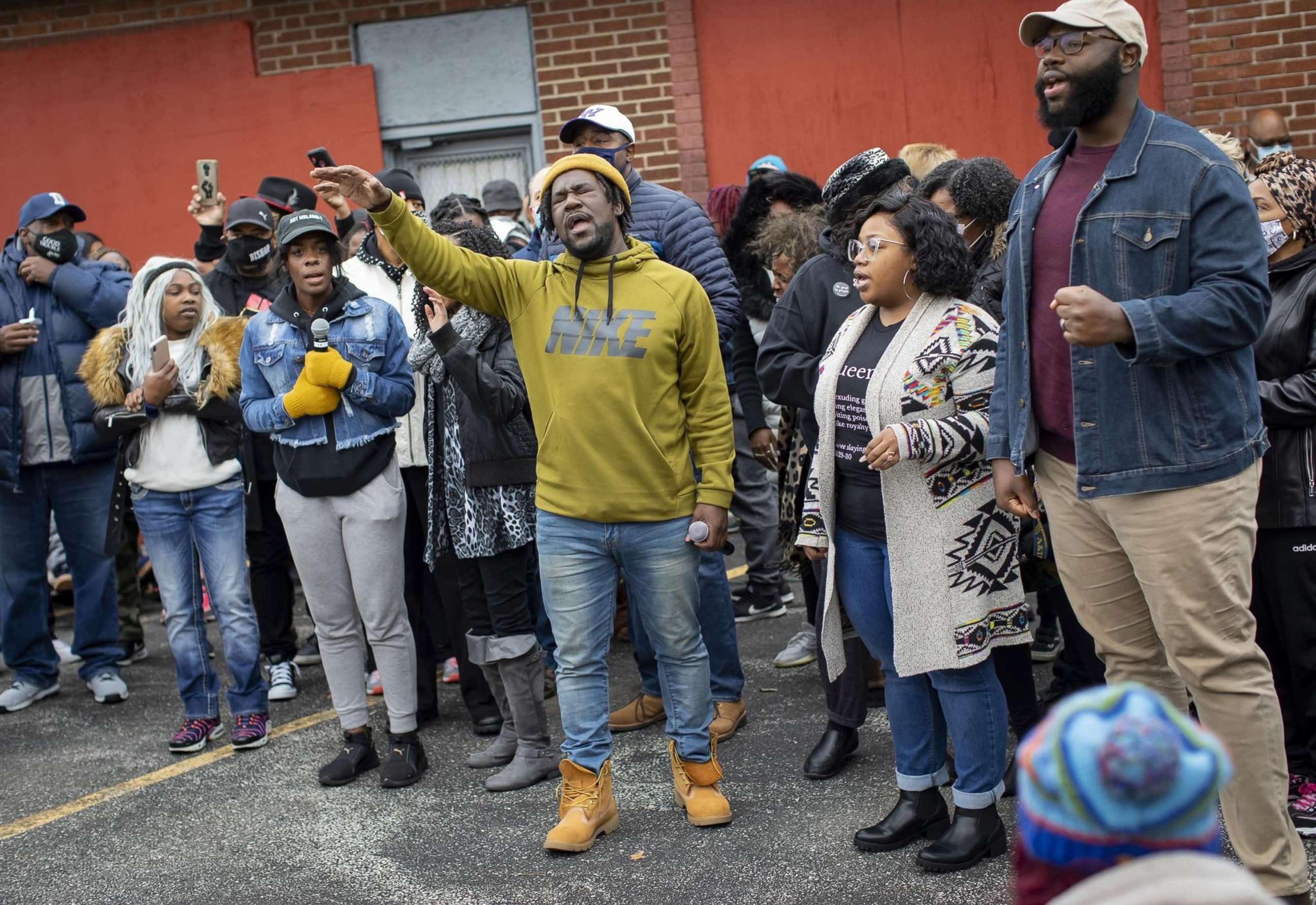 PHOTO: Community members sing during at a prayer vigil for Marcellis Stinnette, 19, on Oct. 25, 2020, in Waukegan, Ill.