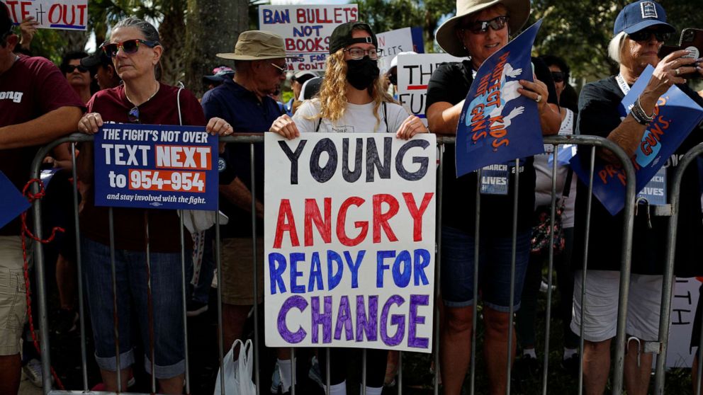 PHOTO: Participants hold placards during a "March for our lives" rally for gun control in Parkland, Fla., June 11, 2022. 