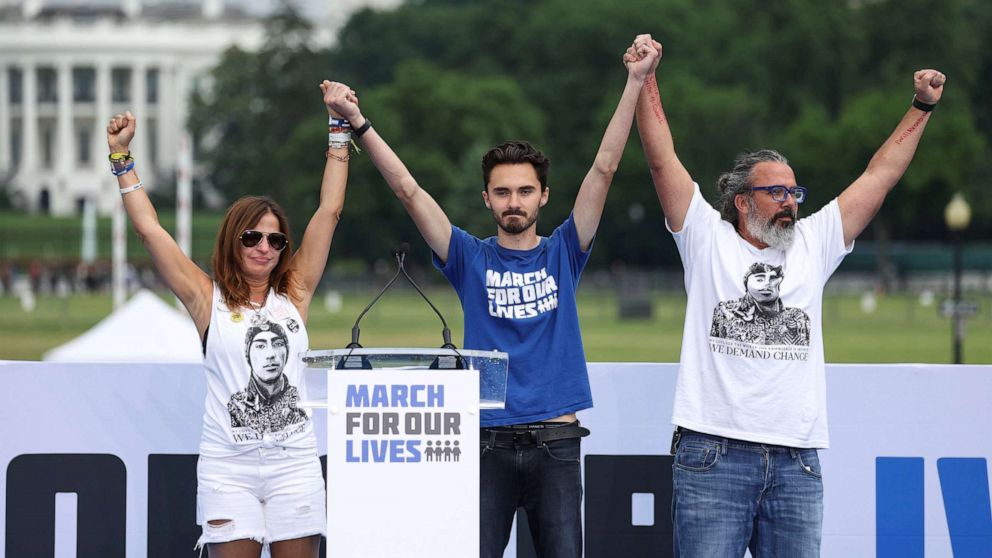 PHOTO: David Hogg (C), Manuel (R) and Patricia Oliver, parents of Parkland shooting victim, speak on stage during a March for Our Lives rally against gun violence on the National Mall, June 11, 2022, in Washington, D.C. 