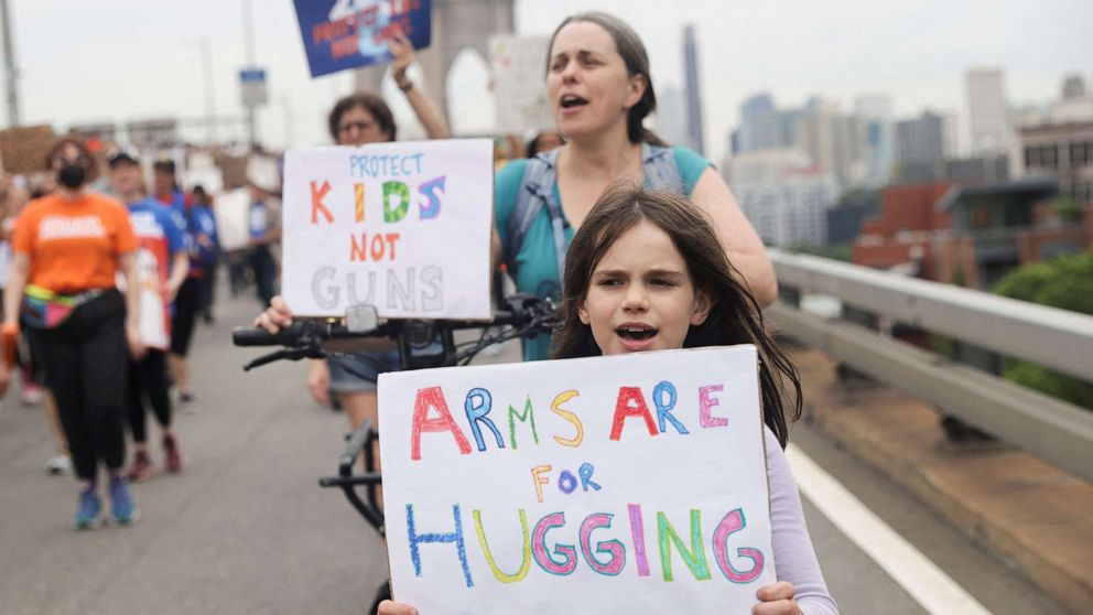 PHOTO: Helen Carpenter, 8 1/2 years old, attends "March for Our Lives" rally, one of a series of nationwide protests against gun violence, in New York, June 11, 2022. 