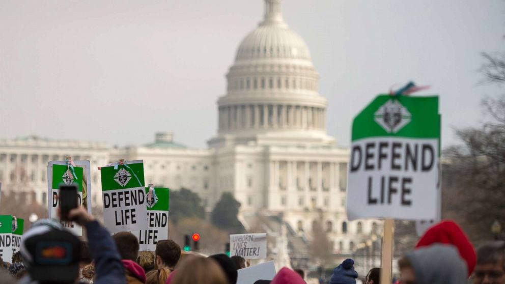 PHOTO: Students and activists carry signs during the annual "March for Life" in Washington, DC, Jan. 18, 2019.