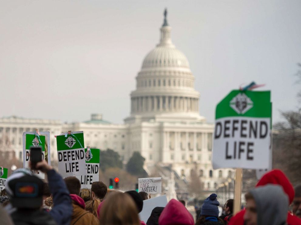 PHOTO: Students and activists carry signs during the annual March for Life in Washington, DC, Jan. 18, 2019.