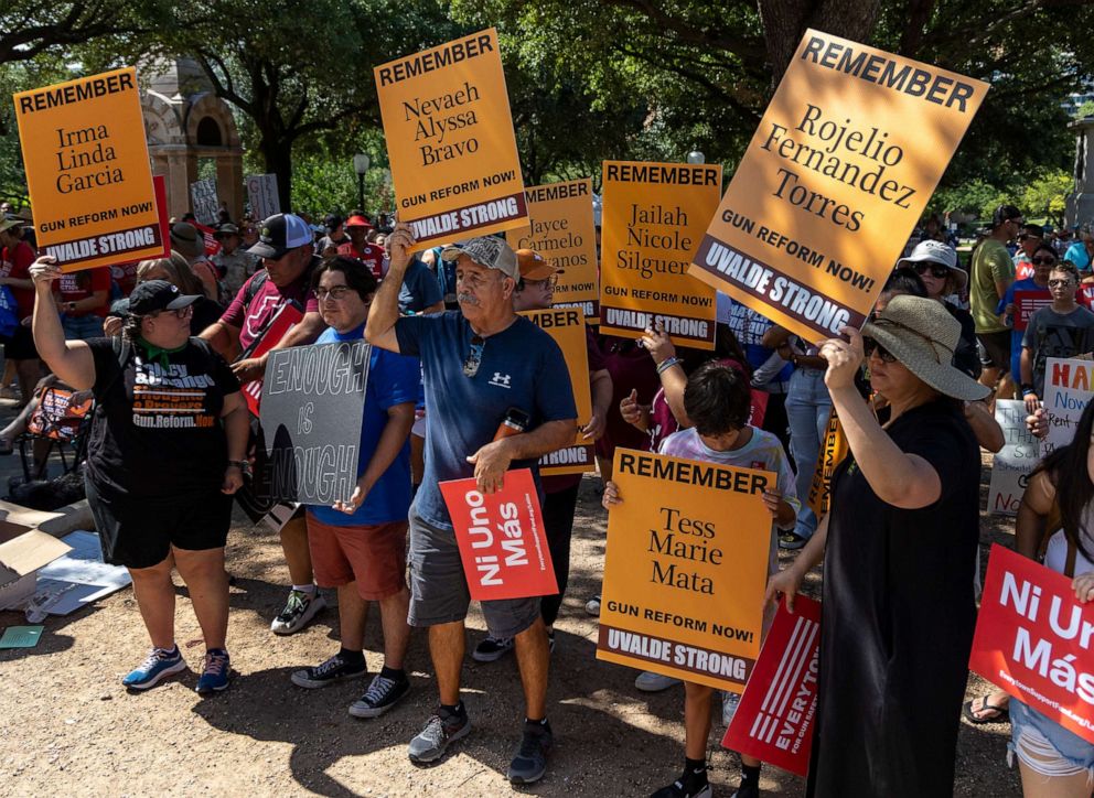 PHOTO: Joe Martinez, center, stands with other attendees to remember the victims of the Uvalde school shooting during a March for our Lives rally at the Texas State Capitol, Aug. 27, 2022, in Austin, Texas.