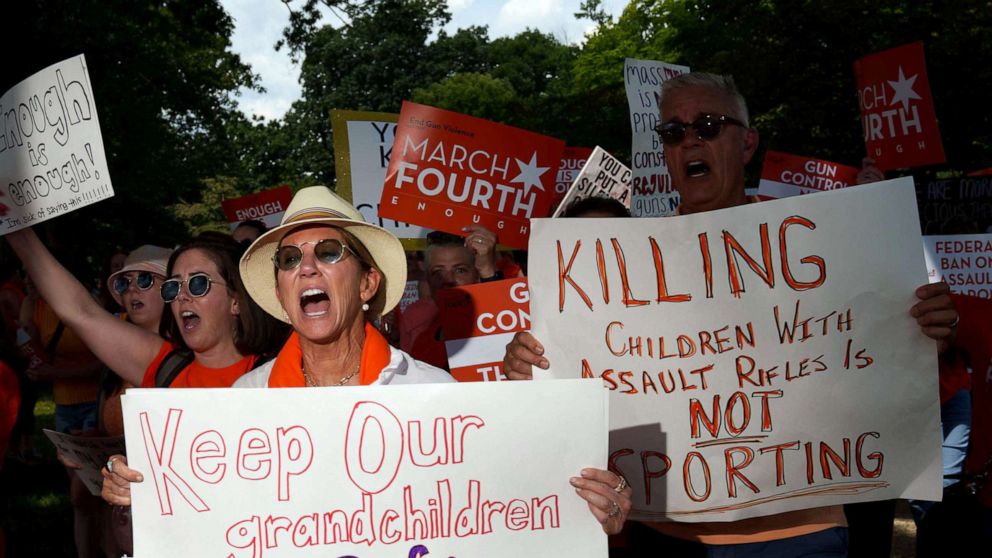 PHOTO: A group from Highland Park, Ill. hold signs at a rally at the U.S. Capitol, July 13, 2022 to call for stronger gun control measures including universal background checks and an assault weapons ban.