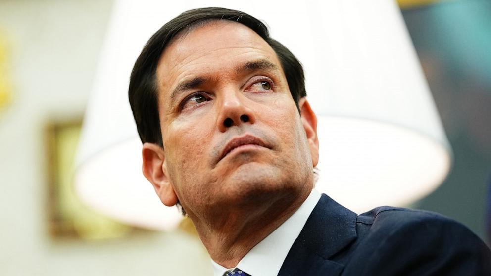 PHOTO: Secretary of State Marco Rubio listens as President Donald Trump meets with NATO Secretary General Mark Rutte in the Oval Office of the White House in Washington, October 22, 2025.