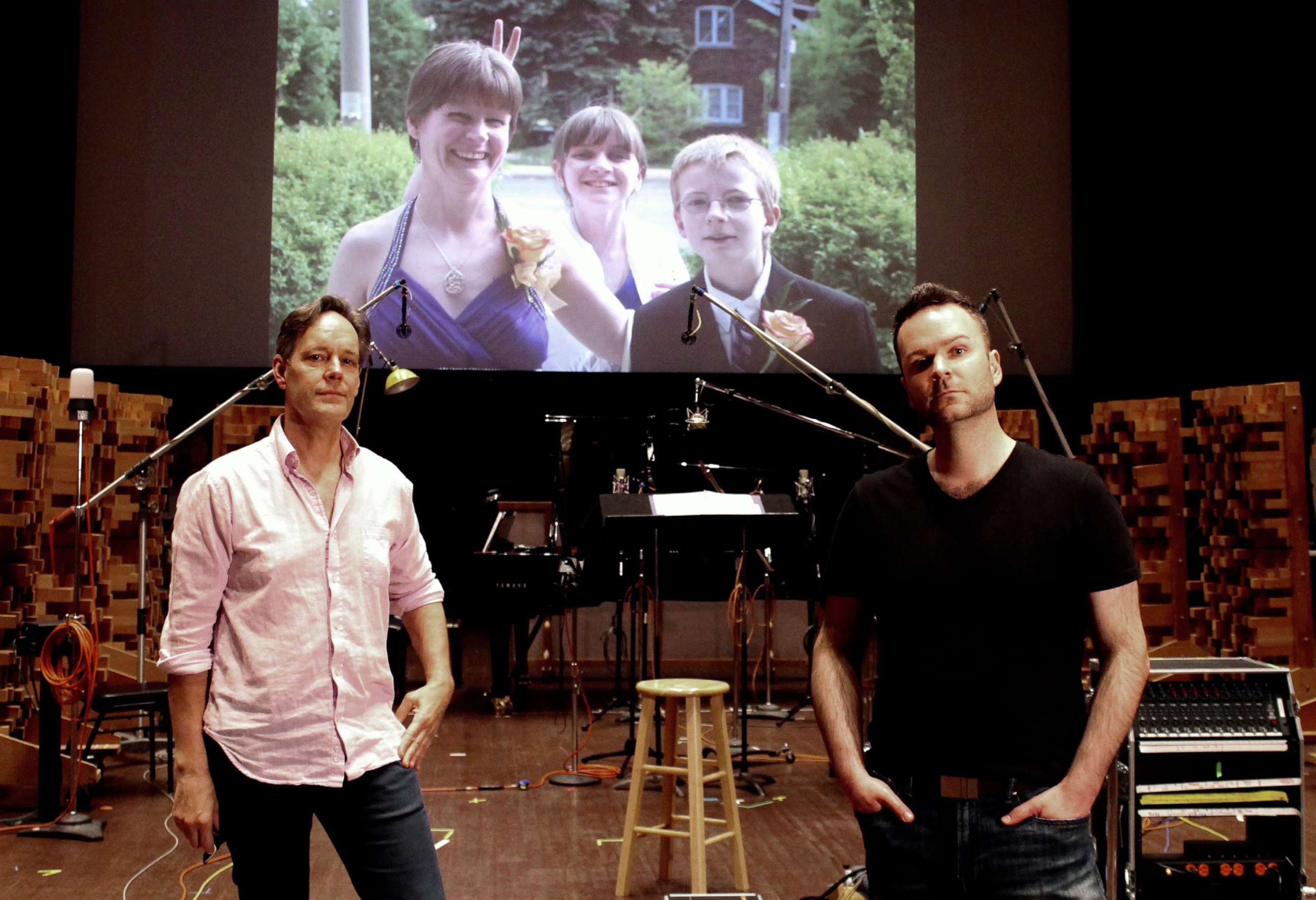 PHOTO: Composer Jake Heggie and baritone Joshua Hopkins on the scoring stage of
Skywalker Sound with an image of Joshua’s sister Nathalie Warmerdam and her two children Valerie and Adrian.