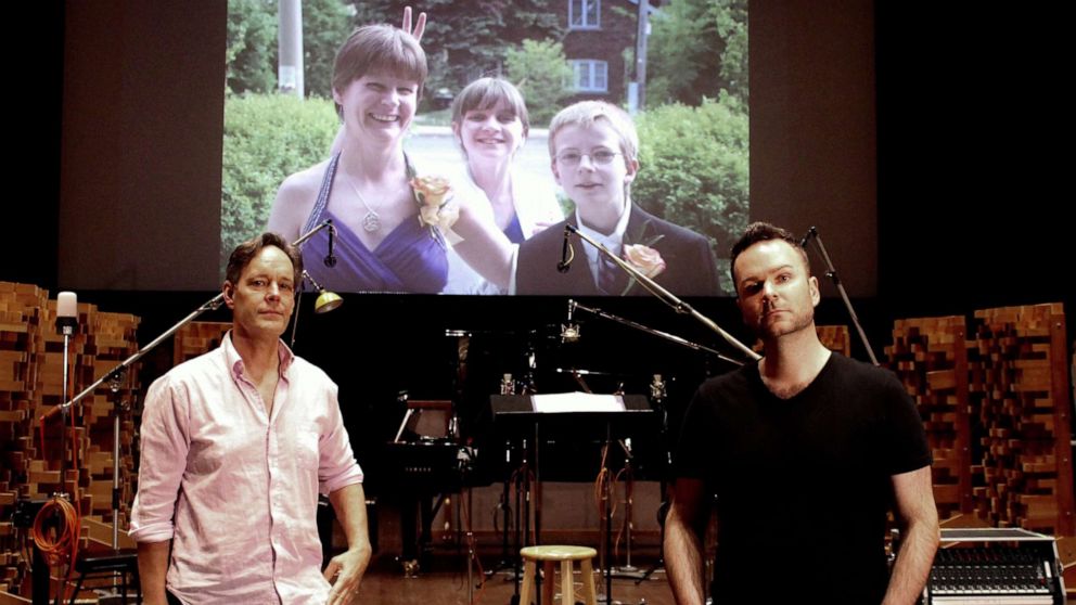 PHOTO: Composer Jake Heggie and baritone Joshua Hopkins on the scoring stage ofSkywalker Sound with an image of Joshua’s sister Nathalie Warmerdam and her two children Valerie and Adrian.