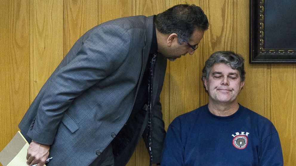 Randall Margraves, right, talks to attorney Mick Grewal, as he prepares to stand in front of Judge Janice Cunningham for a contempt of court hearing after he lunged at Larry Nassar during Nassar's sentencing at Eaton County Circuit Court in Charlotte, Mich., on Feb. 2, 2018.