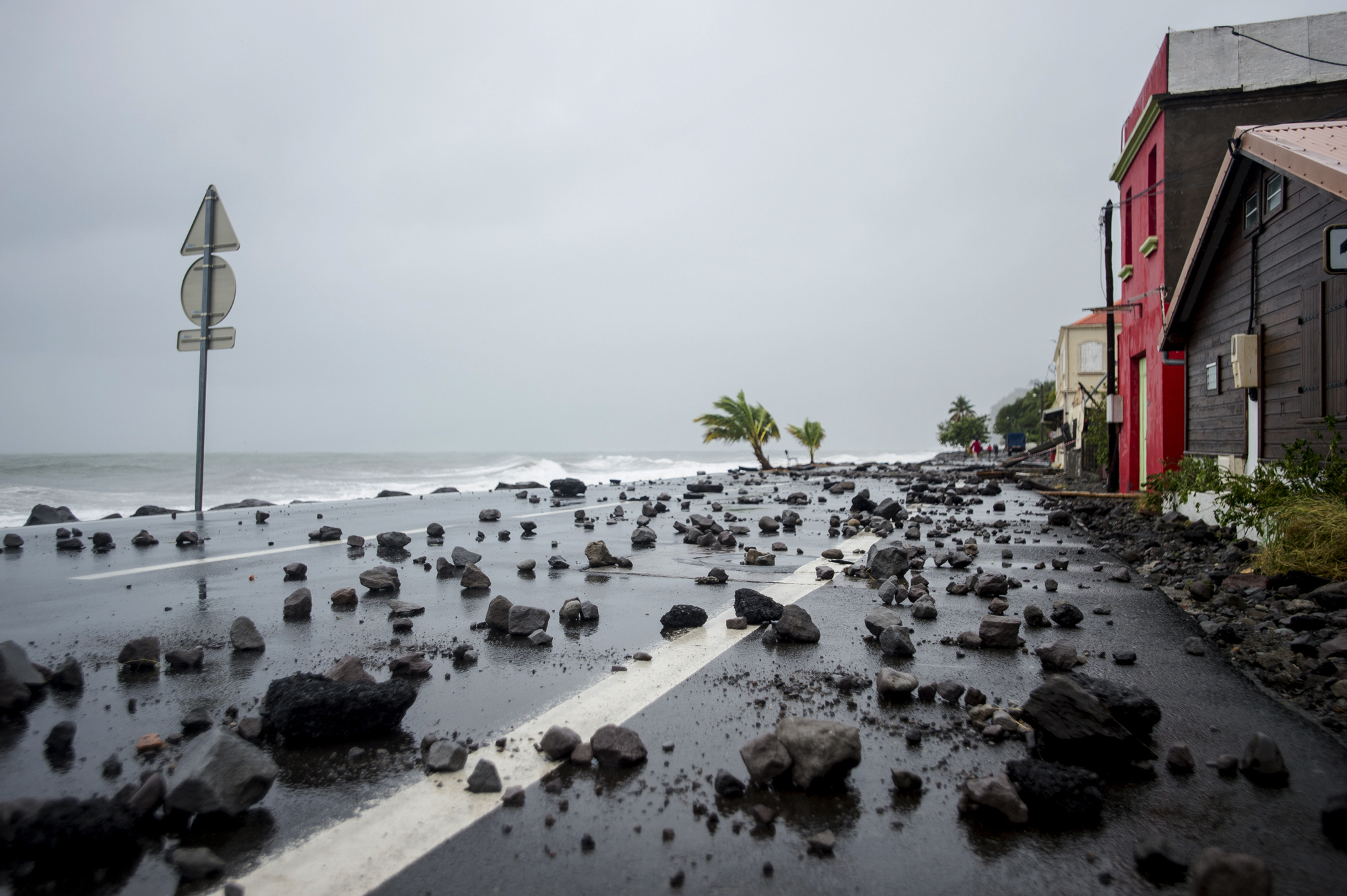PHOTO:Rocks swept by strong waves onto a road in Le Carbet, on the French Caribbean island of Martinique, after it was hit by Hurricane Maria, on September 19, 2017.
 