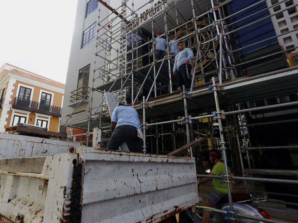 PHOTO: Workers dismantle a scaffold, in San Juan, Puerto Rico, as the city prepares for the arrival of hurricane Maria which is approaching both the Virgin Islands and Puerto Rico with winds of 160 miles per hour, storm surges and torrential rains.