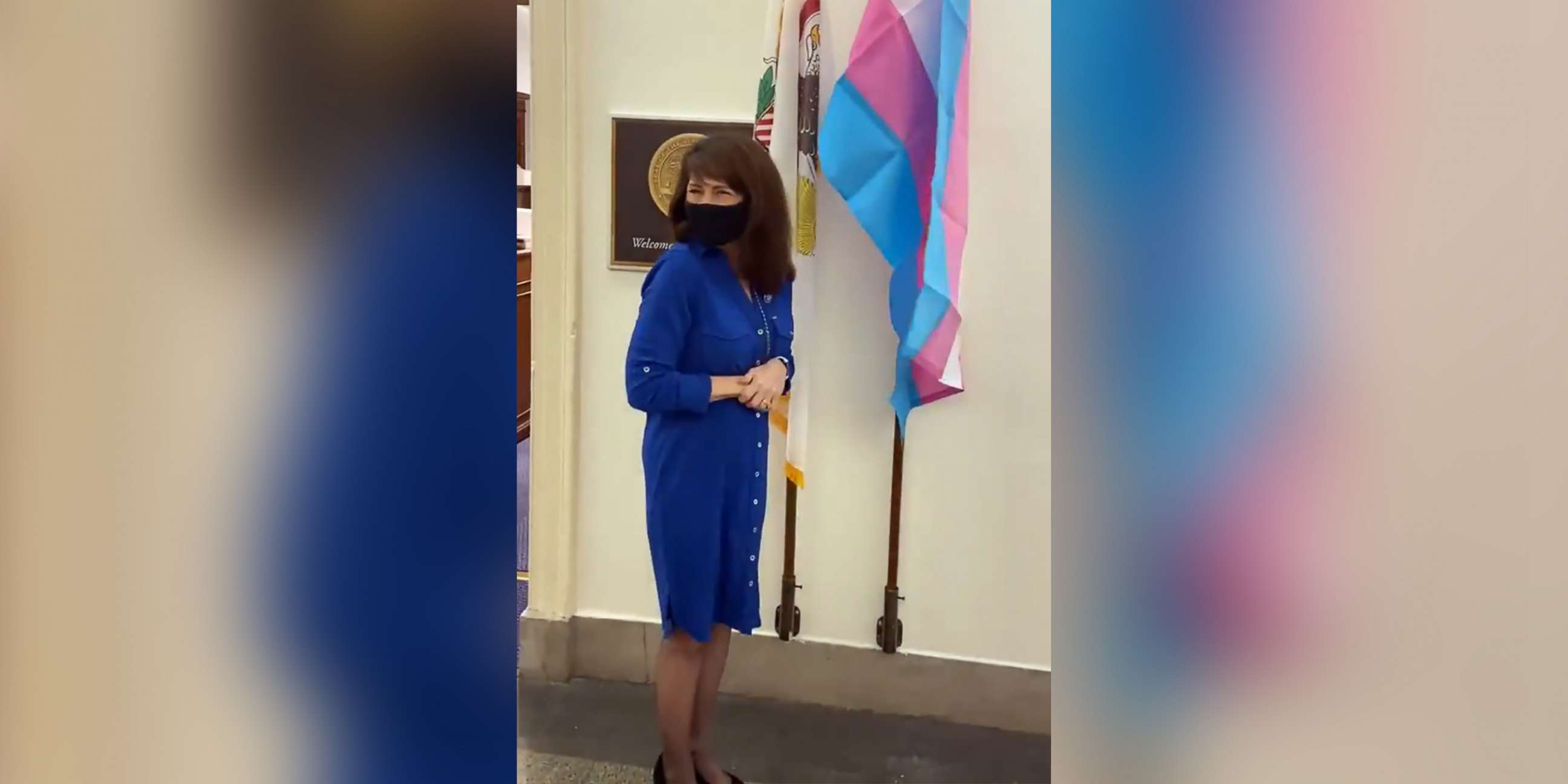 PHOTO: Rep. Marie Newman displays a transgender pride flag in front of her office in Washington, in an image made from video posted to her Twitter account on Feb. 24, 2021.
